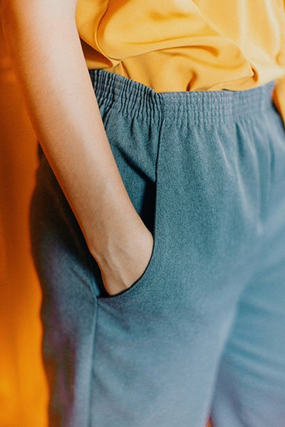 Close-up of a person in casual, comfortable clothing with their hand in their pocket, embodying relaxation and ease, ideal for a first massage experience in Cork.