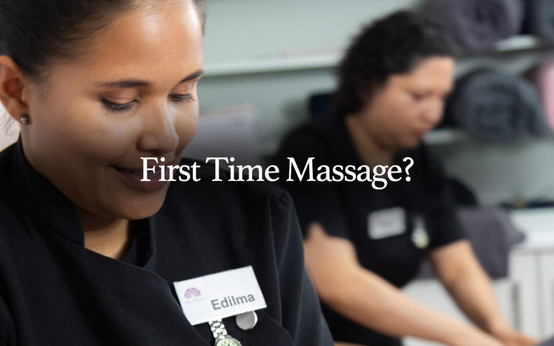 Two massage therapists from Edilma Therapy in Cork, focused and preparing the serene space for a client's first massage session.